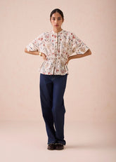 A Model Wearing White Handwoven Cotton Rustic Beginnings Handspun Handwoven Organic Cotton Peplum Top, curated by Only Ethikal